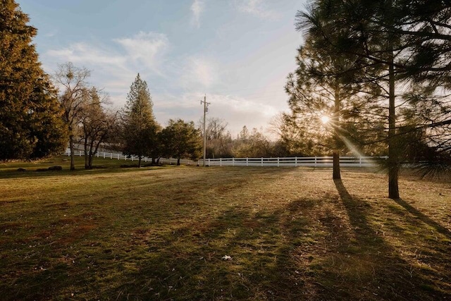 view of yard with a rural view