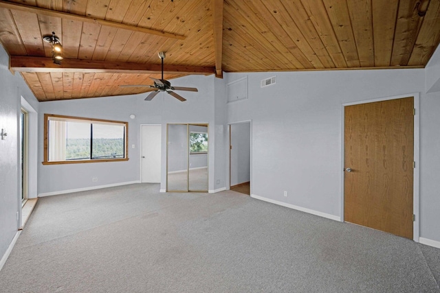 empty room featuring ceiling fan, vaulted ceiling with beams, carpet, and wooden ceiling