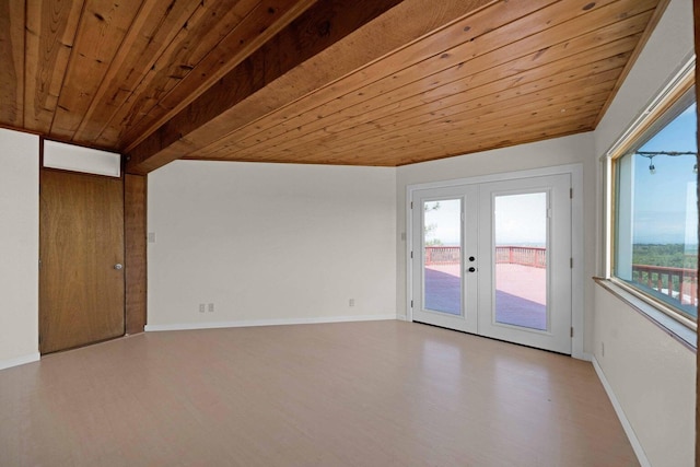 empty room featuring light wood-type flooring, vaulted ceiling with beams, wood ceiling, and french doors