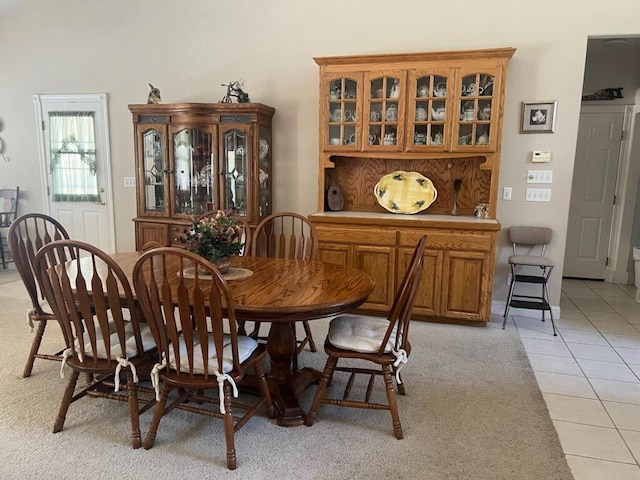 dining space featuring light tile patterned floors