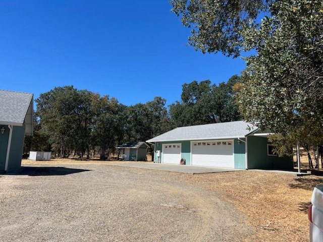 view of side of property with a garage