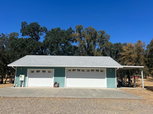 garage featuring a carport