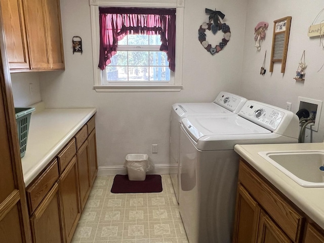 washroom featuring cabinets and independent washer and dryer