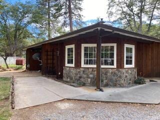 view of side of property featuring a patio