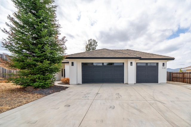1132 Kellinger St, Redding, CA 96003 - garage featuring concrete driveway and fence