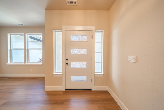 1132 Kellinger St, Redding, CA 96003 - entryway featuring visible vents, baseboards, and wood finished floors