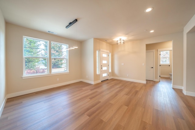 1132 Kellinger St, Redding, CA 96003 - empty room with visible vents, a healthy amount of sunlight, and light wood-style flooring