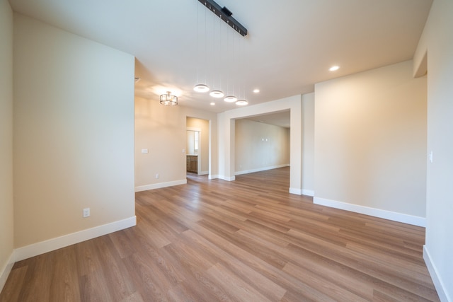 unfurnished room with light hardwood / wood-style floors