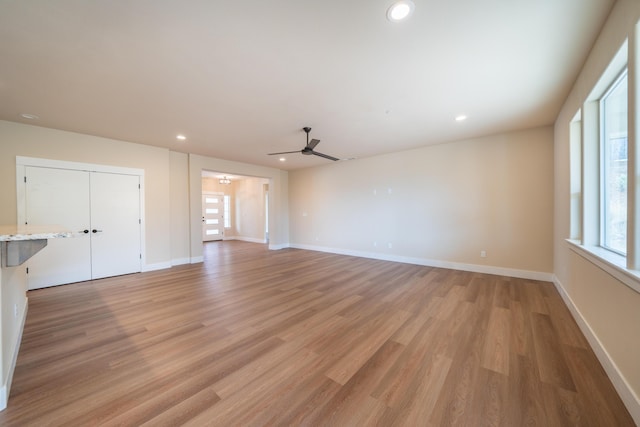 1132 Kellinger St, Redding, CA 96003 - unfurnished living room featuring recessed lighting, baseboards, light wood finished floors, and ceiling fan