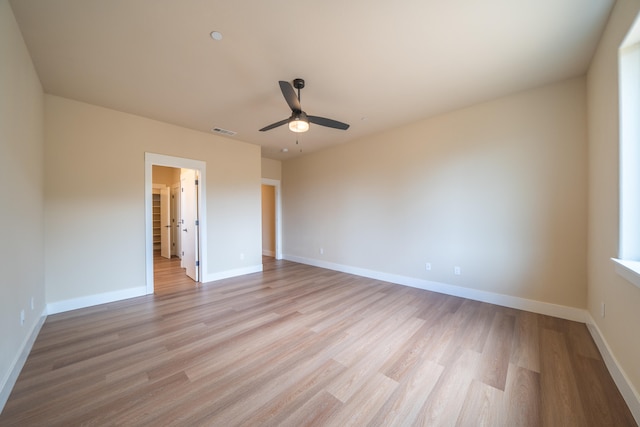 unfurnished bedroom featuring light wood-type flooring and ceiling fan