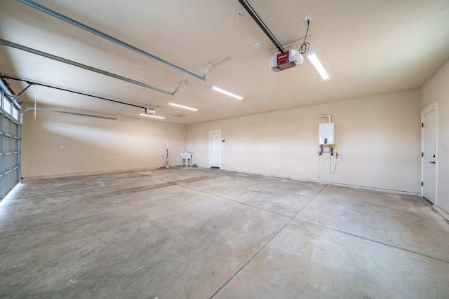 garage with water heater and a garage door opener