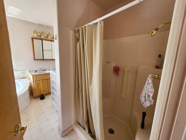 bathroom featuring vanity and curtained shower