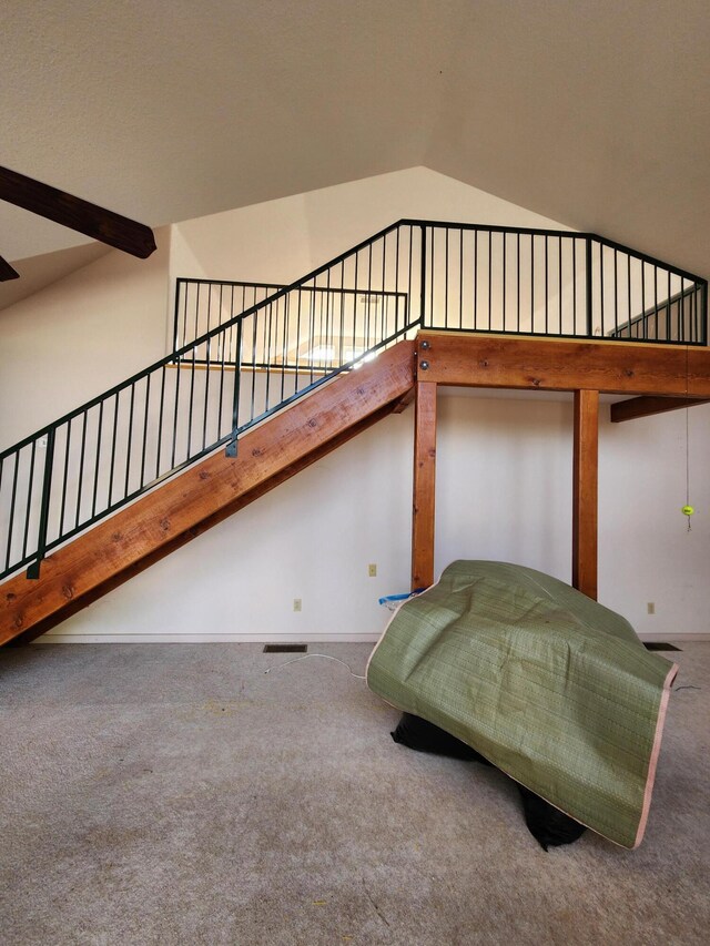 unfurnished bedroom featuring high vaulted ceiling and carpet floors