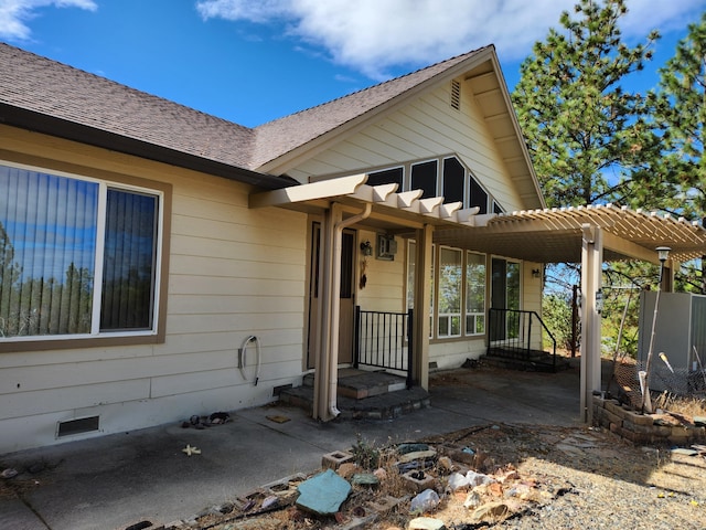 rear view of property with covered porch