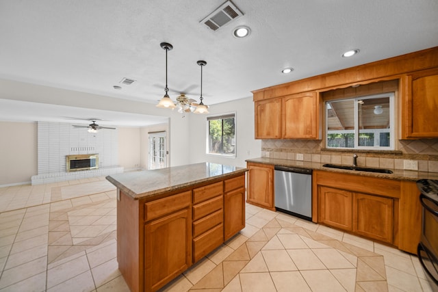 kitchen featuring a kitchen island, decorative backsplash, stainless steel dishwasher, sink, and pendant lighting