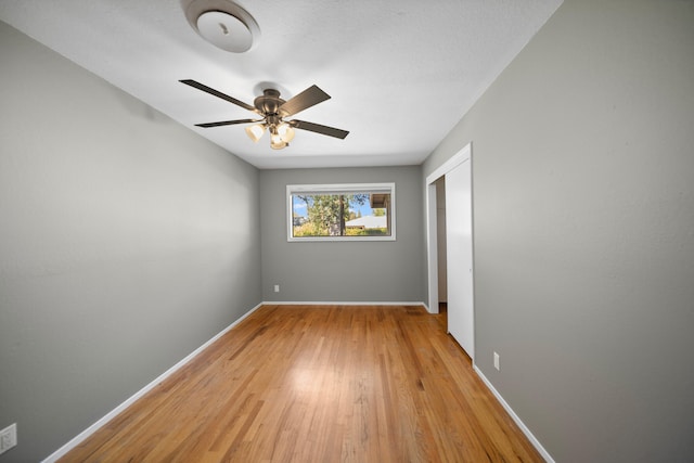 empty room featuring light hardwood / wood-style flooring and ceiling fan