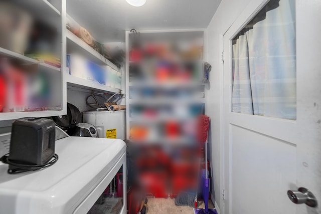 clothes washing area with water heater