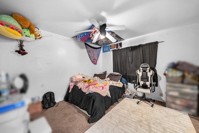 bedroom featuring ceiling fan and carpet floors