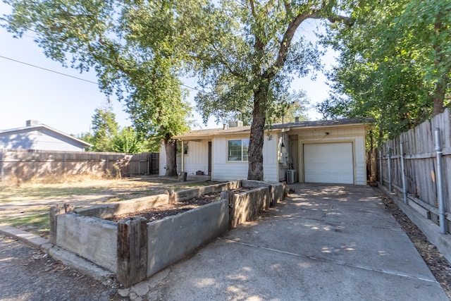 single story home featuring a garage