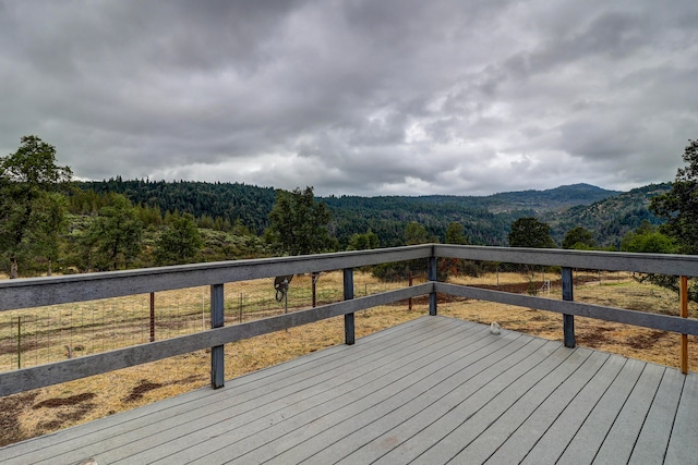 wooden deck with a mountain view