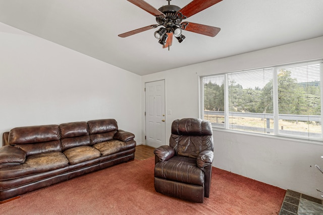 living room featuring vaulted ceiling, ceiling fan, and carpet floors