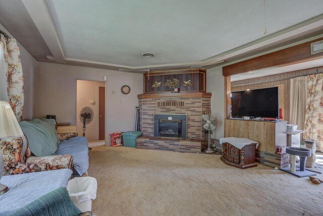 living room with a fireplace and carpet flooring