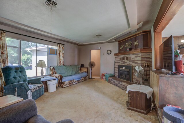 living room featuring light colored carpet and a fireplace