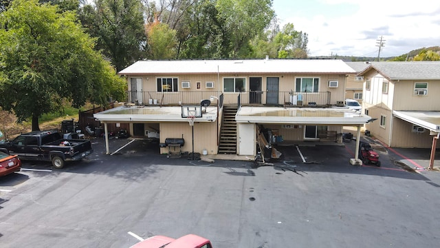 view of front of house with a carport and a balcony