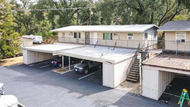 back of property featuring a carport