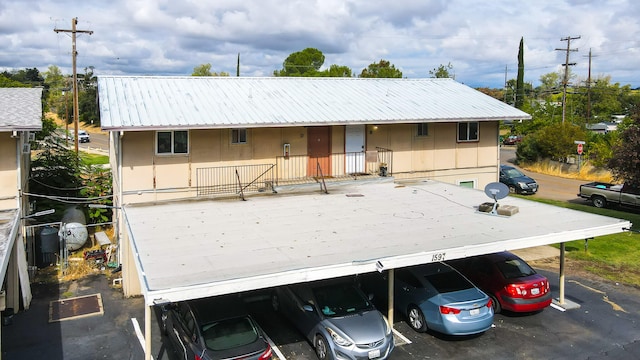 exterior space with a carport