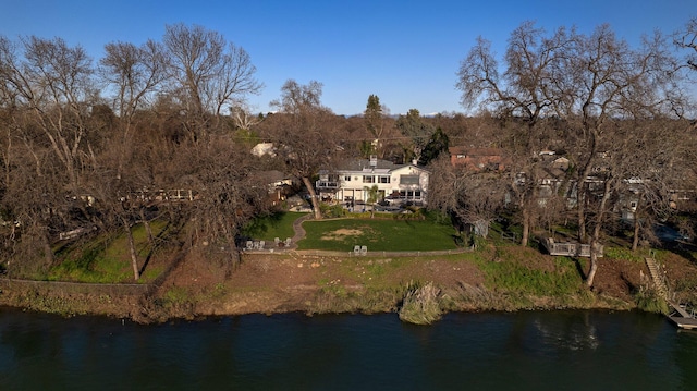 birds eye view of property with a water view