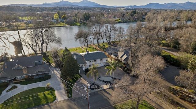 birds eye view of property featuring a water and mountain view