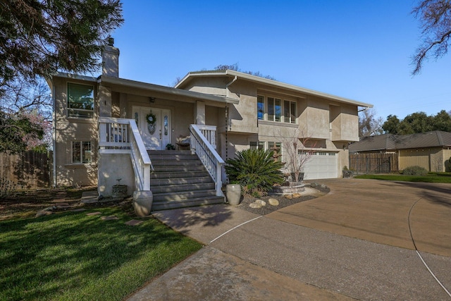 view of front of home featuring a garage and a front lawn