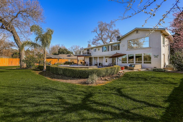 rear view of property with a lawn