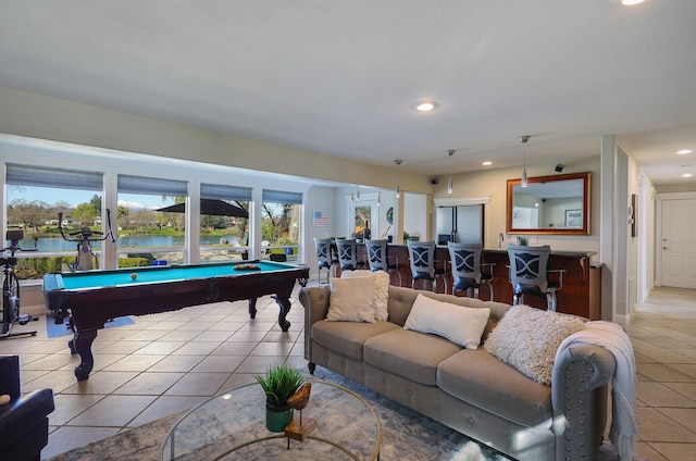 playroom with light tile patterned flooring, pool table, and a water view