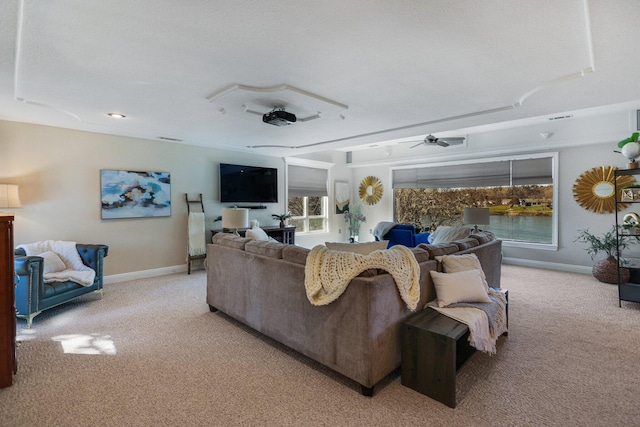 living room with ceiling fan and light colored carpet