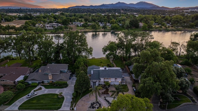 aerial view at dusk with a water and mountain view