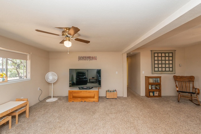 living room with ceiling fan and carpet flooring