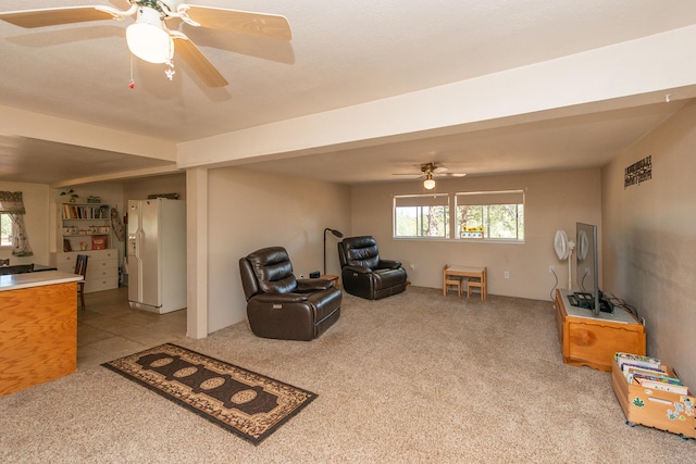 sitting room with light carpet and ceiling fan