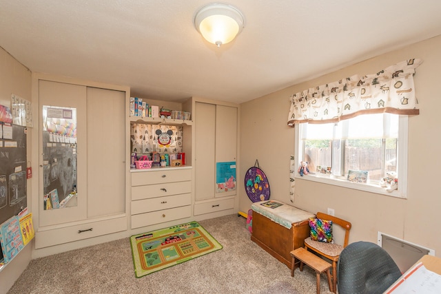 recreation room featuring light colored carpet