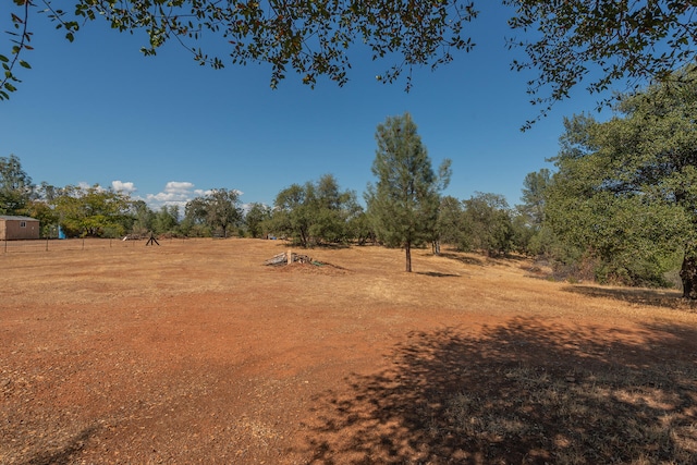 view of yard with a rural view