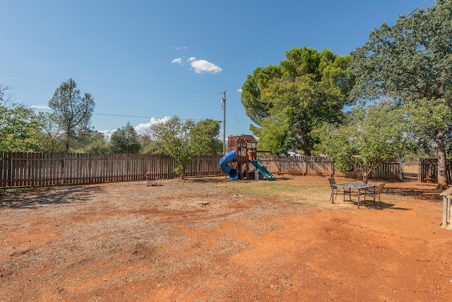 view of yard with a playground