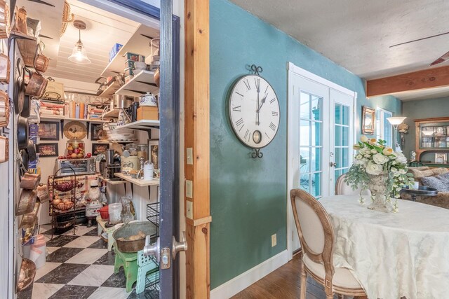 dining area with hardwood / wood-style flooring and french doors