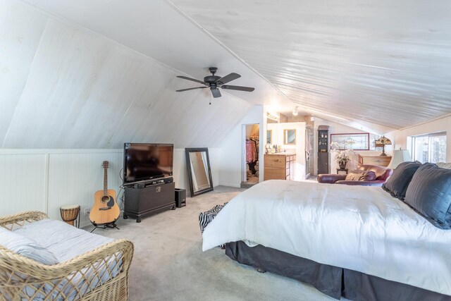 bedroom with ceiling fan, light carpet, and vaulted ceiling