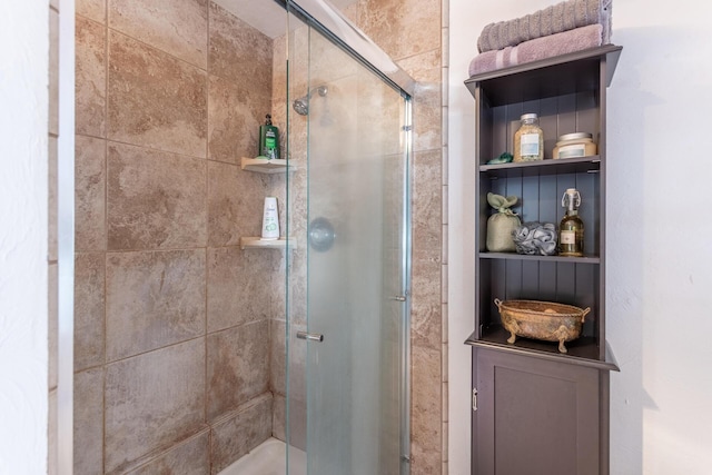 full bath with a shower stall