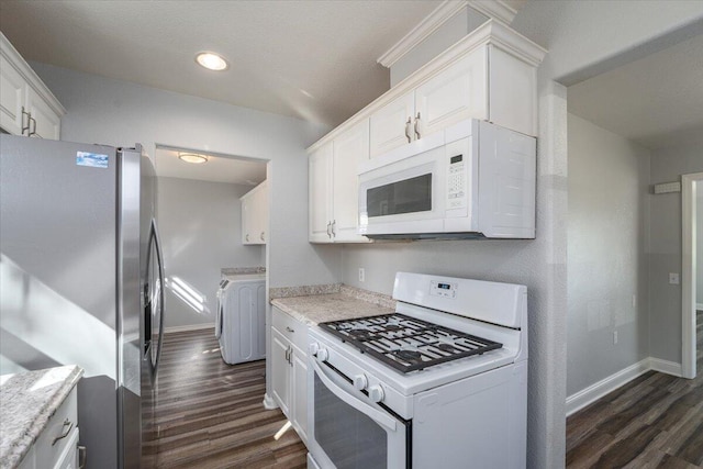 kitchen with white appliances, dark wood finished floors, white cabinetry, and baseboards