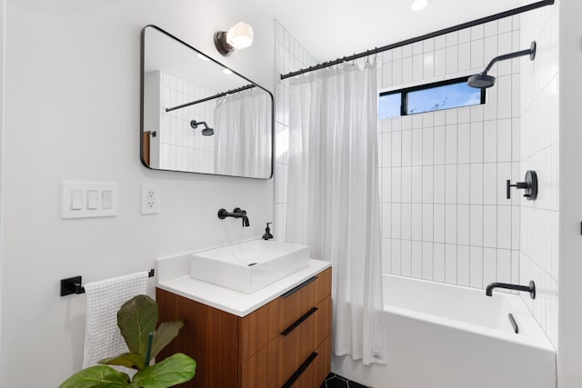 bathroom featuring shower / tub combo and vanity