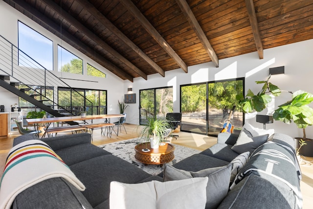 living area featuring wood ceiling, stairs, high vaulted ceiling, and beam ceiling