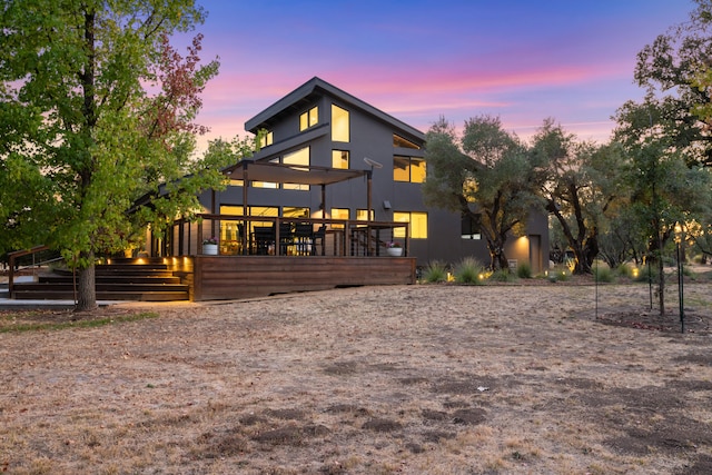 back of property featuring a deck