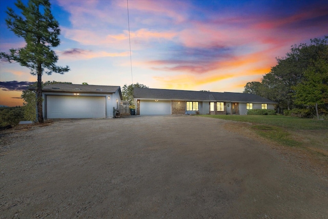 ranch-style house featuring a garage